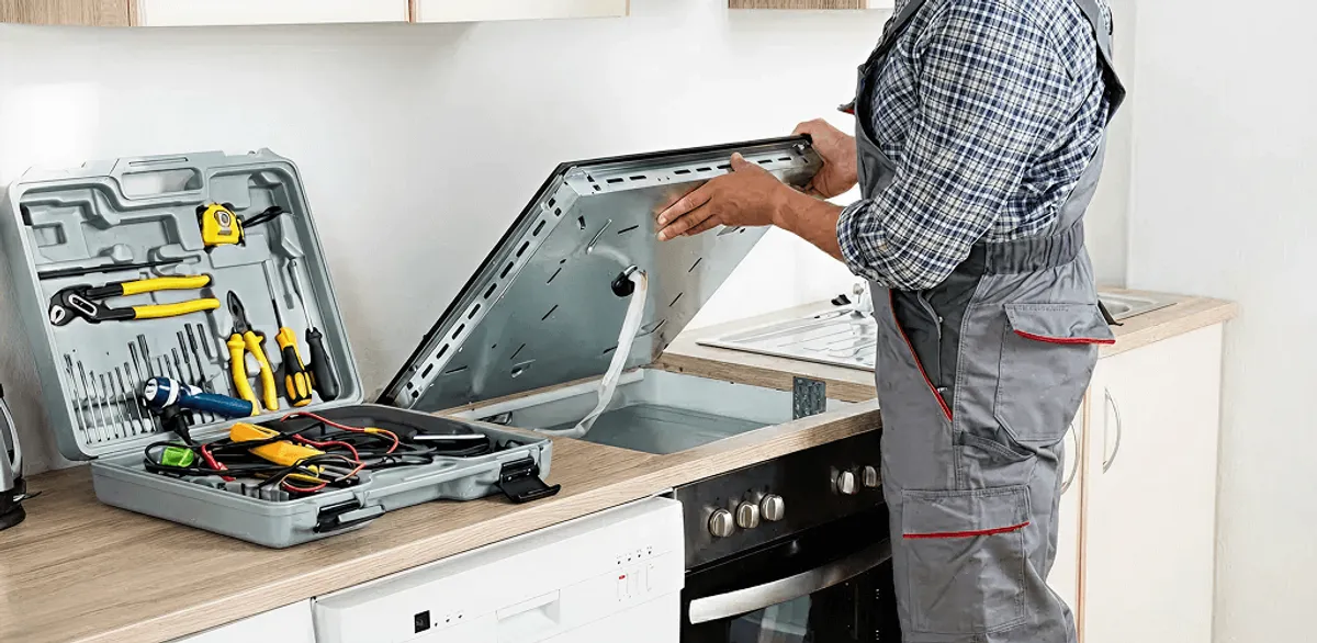 Handyman repairing a cooktop and checking wiring connections in Cape Coral, FL