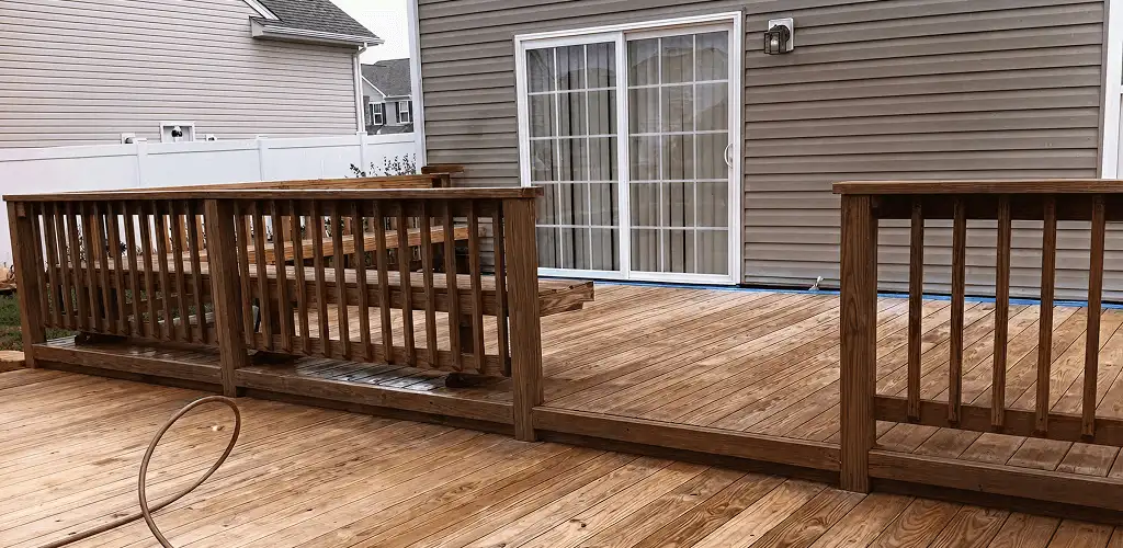 Deck sealing service protecting a backyard wood deck and railings in Cape Coral, FL