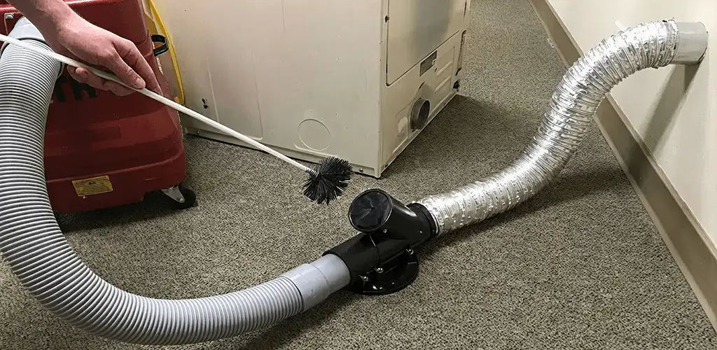 Dryer vent cleaning service removing lint from a dryer duct connection in Cape Coral, FL