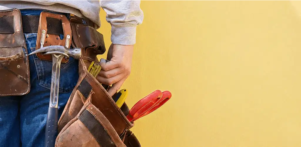 Handyman with tool belt ready for home repairs and maintenance in Cape Coral, FL