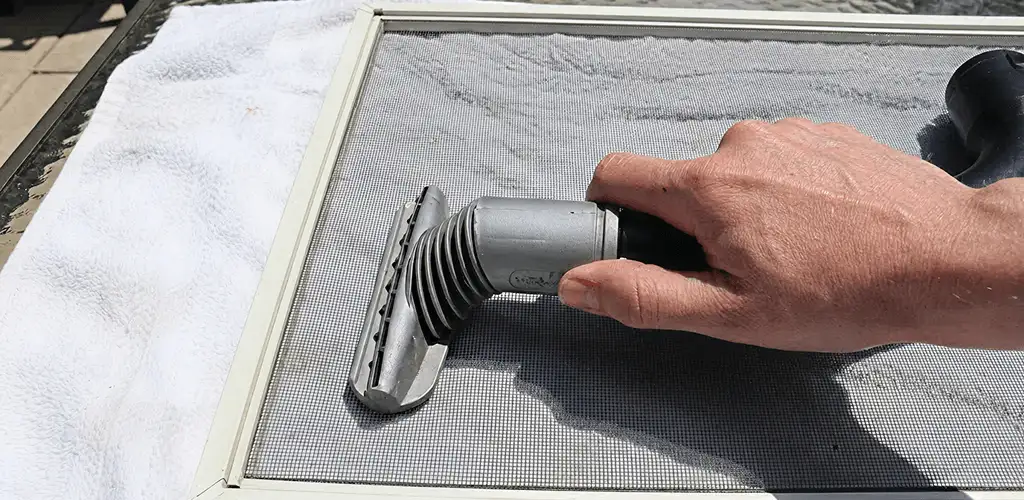 Window screen repair cleaning and fixing a damaged screen mesh in Cape Coral, FL